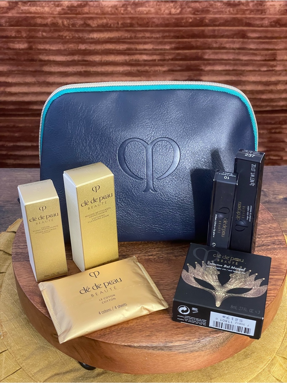 CLE DE PEAU 7 Piece Beauty Bundle: Bag, Skincare, & Cosmetics